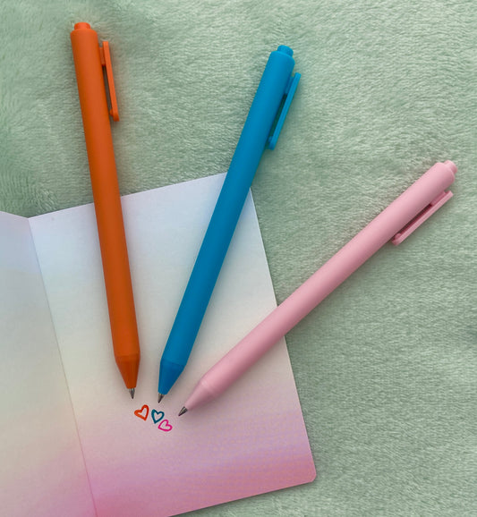 colorful orange, blue, and pink gel pens